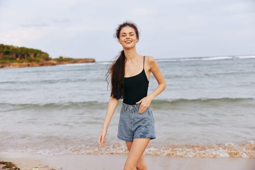 summer woman copy-space vacation sea sun hair smile sand water girl sunset happiness beach sunlight long enjoyment lifestyle ocean caucasian running jean