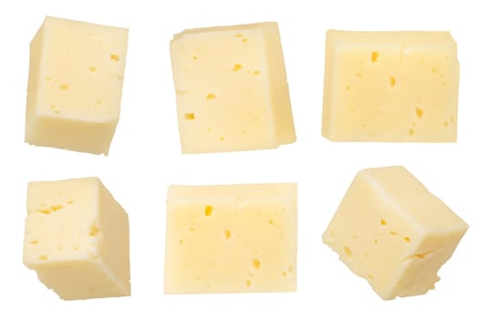 Pieces of cheese isolated on white background. Cheese for pizza. Cheese cut into squares on a white background, close-up. To insert into a design or project. High quality photo.