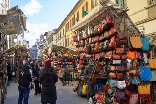 06 Dec, 2021 - Florence, Italy. San Lorenzo Street Market with many lether goods such as belts, bags, and wallets on display