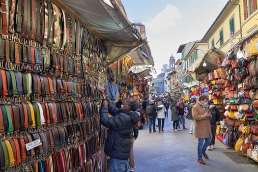 06 Dec, 2021 - Florence, Italy. San Lorenzo Street Market with many lether goods such as belts, bags, and wallets on display