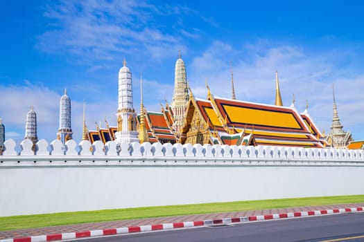 Thailand on street and background of Wat Phra Kaew (Temple of the Emerald Buddha).