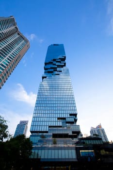 BANGKOK, THAILAND - APRIL 30, 2022: Mahanakorn sky scraper the higher modern building landmark with Sathorn Square commercial office and hotel at Sathorn bussiness center of Bangkok city