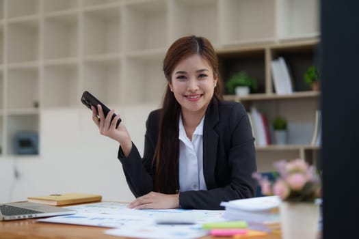 Beautiful business woman talking on the mobile phone. Management, planning and networking phone call concept.