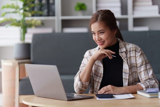 Accountant asian woman working on laptop and do document, tax, exchange, accounting and Financial advisor concept.