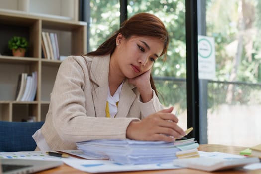 Deadline with young business woman feeling stressed concept. Business woman working at office, business finance concept.