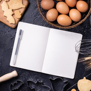 Making cookies cookbook recipe design concept, baking ingredients preparation layout with notebook, top view, flat lay, overhead, mockup copy space.