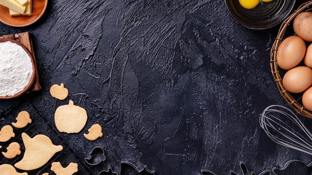 Design concept of making Halloween cookies, baking recipe ingredients layout of preparing party, top view, flat lay, overhead, blank copy space.