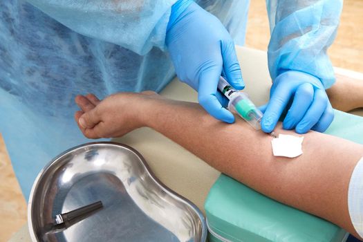 Nurse doing blood test from vein. Covid testing concept