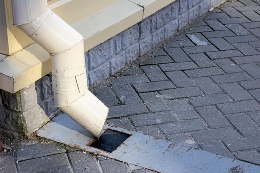 Rainwater drainage system on the sidewalk close up