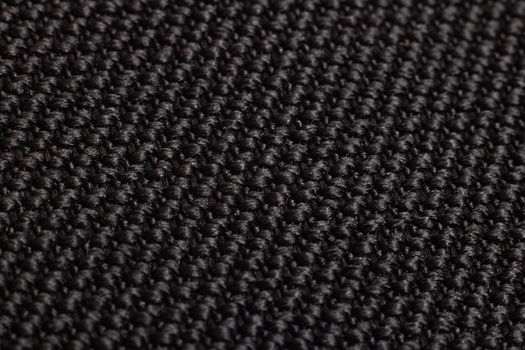 Black knitted fabric close up, background and texture