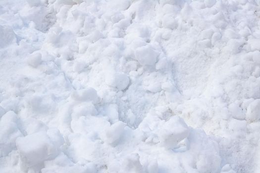 Clods of white snow close up, background or texture
