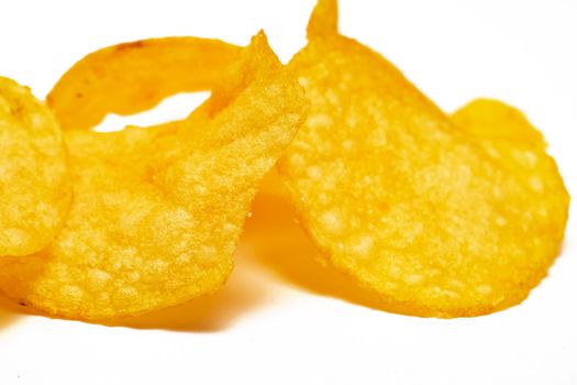 Potato chips close up on a white background
