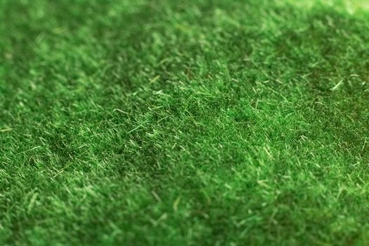Artificial green grass close up, background or texture