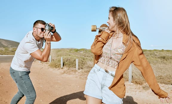 Photo, skateboard and couple on a road trip in nature to travel during summer. Photographer, love and man with a vintage camera and picture of an influencer ready for skateboarding in countryside.