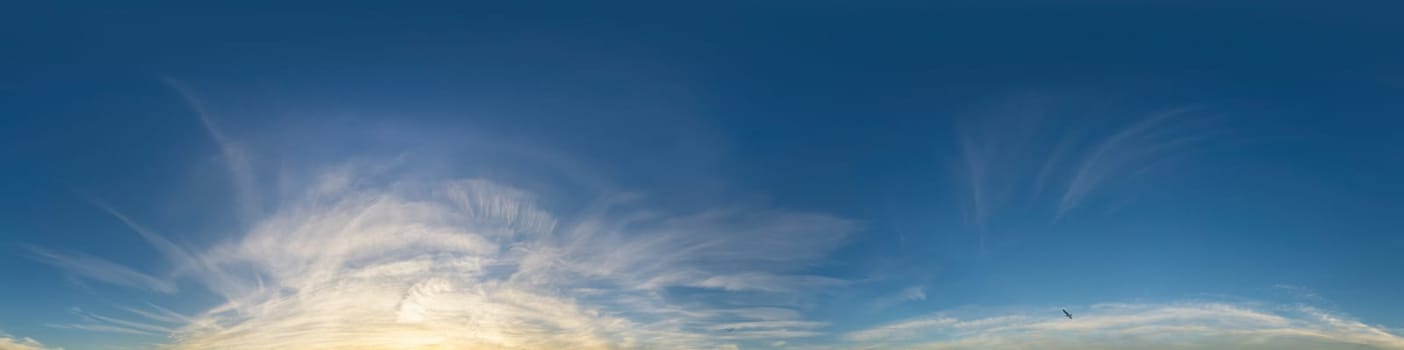 Bright sunset sky panorama with Cirrus clouds. Seamless hdr spherical equirectangular 360 panorama. Sky dome or zenith for 3D visualization, game and sky replacement for aerial drone 360 panoramas.