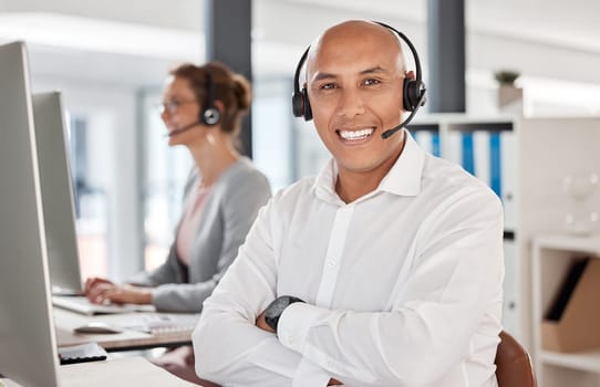 Portrait, call center and customer service worker happy working in telemarketing office with headset and computer. Customer support consultant, smile employee and crm communication in sales company.