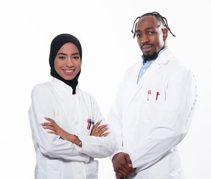 Closeup front view of group of mixed age doctors and nurses standing side by side and looking at the camera. Young Middle Eastern female in a team with African American black doctor. High quality photo