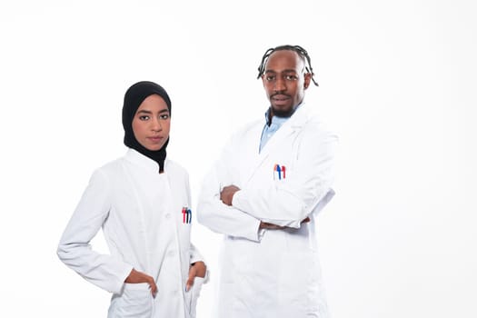 Closeup front view of group of mixed age doctors and nurses standing side by side and looking at the camera. Young Middle Eastern female in a team with African American black doctor. High quality photo