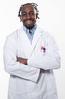 Doctor dark skin guy virologist agent corona virus seminar conference arms crossed pandemic virus expert wear white lab coat isolated white color background using a tablet computer. High quality photo