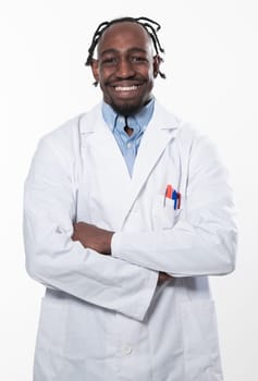 Doctor dark skin guy virologist agent corona virus seminar conference arms crossed pandemic virus expert wear white lab coat isolated white color background using a tablet computer. High quality photo