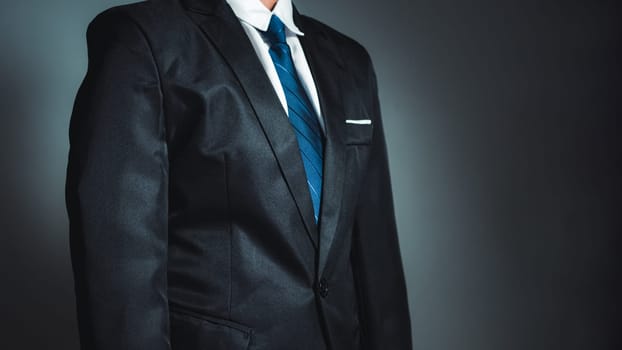 businessman standing on dark gradient background. business concept. suit.