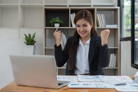 winner business woman with laptop, email announcement of promotion or bonus success. Excited corporate person with fist pump for office celebration, salary increase or target.