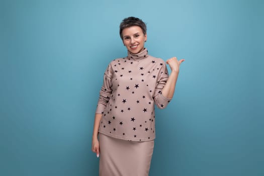 successful young caucasian boss woman with short hair in a skirt and blouse on a background with copy space.