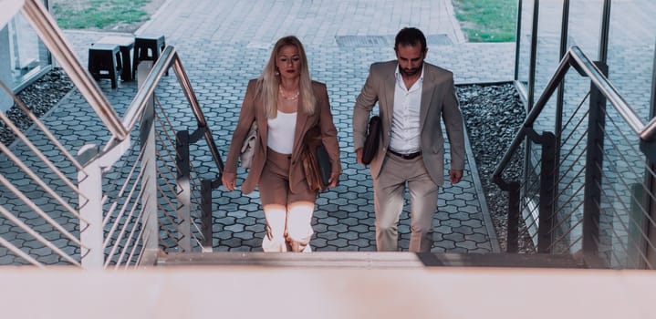 Modern business couple after a long day's work, walking together towards the comfort of their home, embodying the perfect blend of professional success and personal contentment