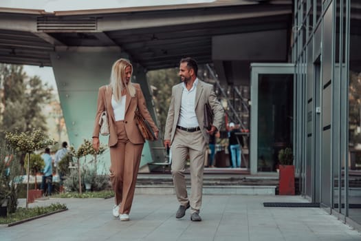 Modern business couple after a long day's work, walking together towards the comfort of their home, embodying the perfect blend of professional success and personal contentment