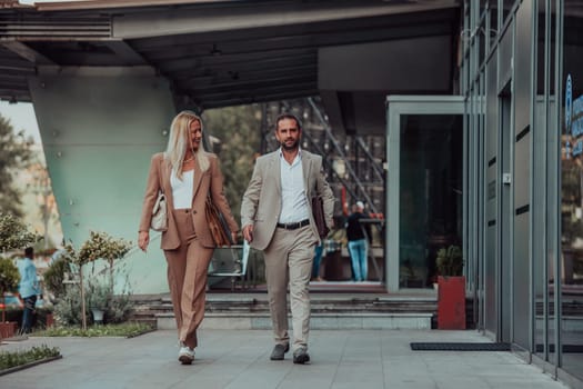 Modern business couple after a long day's work, walking together towards the comfort of their home, embodying the perfect blend of professional success and personal contentment