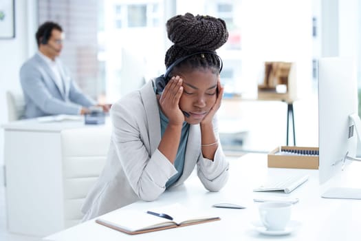 Tired, stress and headache with black woman in call center office for fatigue, anxiety and burnout. Frustrated, mental health and glitch with female employee for communication and customer service.