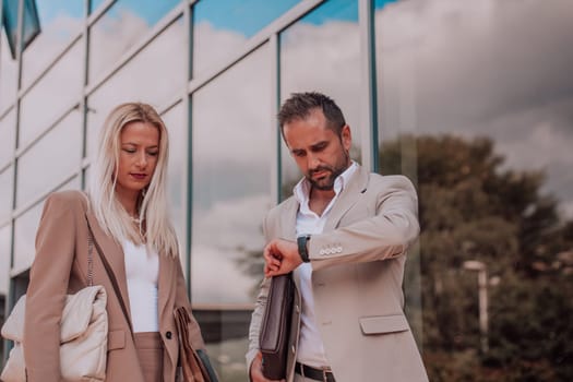 Modern business couple after a long day's work, walking together towards the comfort of their home, embodying the perfect blend of professional success and personal contentment