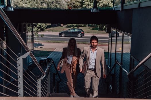 Modern business couple after a long day's work, walking together towards the comfort of their home, embodying the perfect blend of professional success and personal contentment