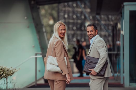 Modern business couple after a long day's work, walking together towards the comfort of their home, embodying the perfect blend of professional success and personal contentment