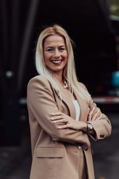 A powerful portrait of a businesswoman, standing confidently with her arms crossed, representing the determination of the female gender and embodying strength and success.