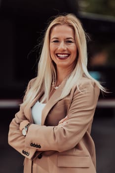 A powerful portrait of a businesswoman, standing confidently with her arms crossed, representing the determination of the female gender and embodying strength and success.