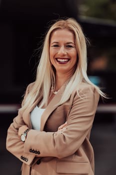 A powerful portrait of a businesswoman, standing confidently with her arms crossed, representing the determination of the female gender and embodying strength and success.