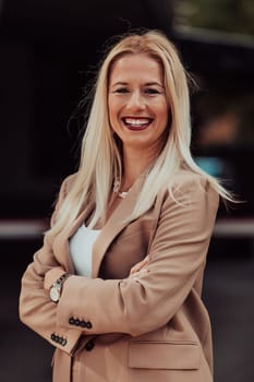 A powerful portrait of a businesswoman, standing confidently with her arms crossed, representing the determination of the female gender and embodying strength and success.