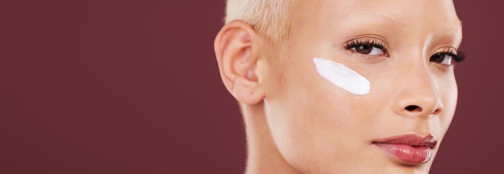 Skincare, beauty and portrait of woman with cream on face, cosmetics and skin product on studio background. Dermatology, spa facial treatment and model isolated with mockup, anti ageing care and glow.