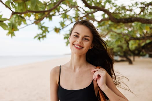 woman enjoyment water beach young caucasian sand sun vacation person summer happy free leisure ocean walking smiling sea smile long nature hair