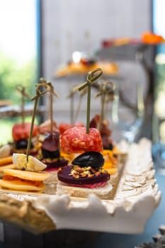 close-up of assorted canapes on the buffet table.