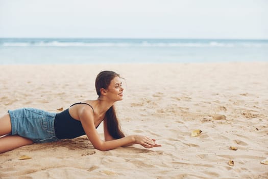 travel woman nature beach model coast caucasian vacation tropical fashion relax sand beauty sitting sexy smile alone freedom beautiful sun sea