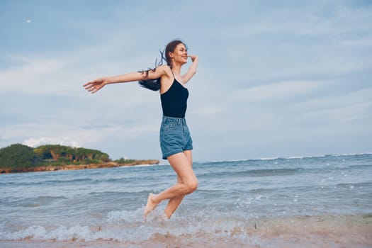 woman walking sea summer shore lifestyle sun sunset beautiful happiness hair carefree body beach sexy smile travel young long smiling running happy