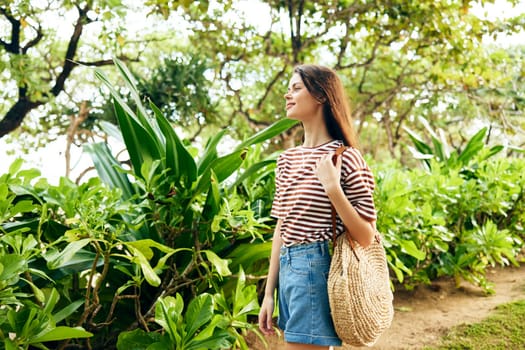 woman hat quiet walk fun t-shirt smiling hair outdoor striped park hipster long carefree grass lifestyle summer day nature freedom beautiful sunset