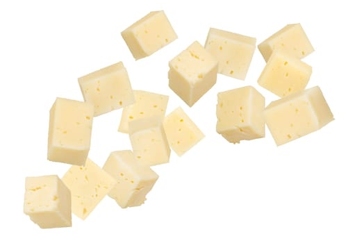Lots of cheese pieces isolated on a white background. Cheese for pizza. A lot of pieces of cheese fall on the isolate, cut into squares on a white background, close-up. Insert into design or project
