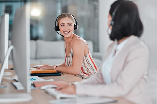 Telemarketing, teamwork and women talking in call center, office or company workplace. Customer service, collaboration and happy female sales agents, consultants or friends in communication or chat