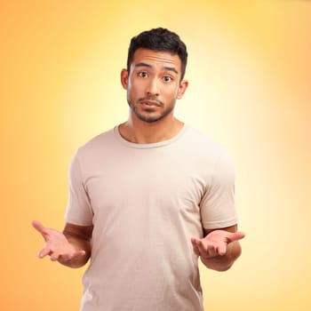 Man, confused and hands out isolated with questions and asking why on yellow background with mockup. Confusion, doubt and person from India with problem and frustrated hand gesture in studio portrait.