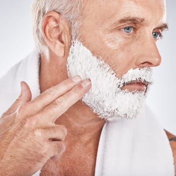 Man face, hands or grooming shaving foam in health maintenance or beauty aesthetic on gray studio background. Zoom, mature model or hair removal cream in facial cleaning, growth or hygiene skincare.
