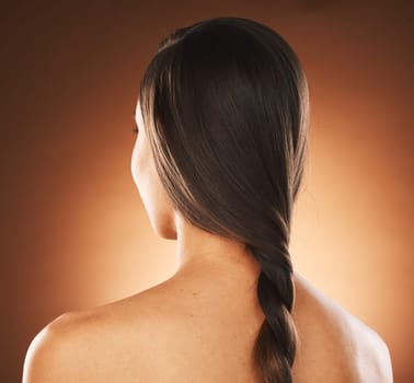 Back view, hair braid and studio woman, beauty salon and cosmetics for hair style, hairdresser and brunette color dye. Hair care, fashion and plait hairstyle of girl model, texture and healthy shine.