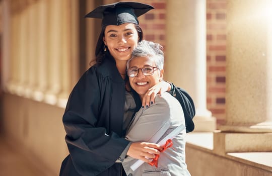 Graduation, university and portrait of mother with girl at academic ceremony, celebration and achievement. Family, education and mom hugging graduate daughter with degree or diploma on college campus.